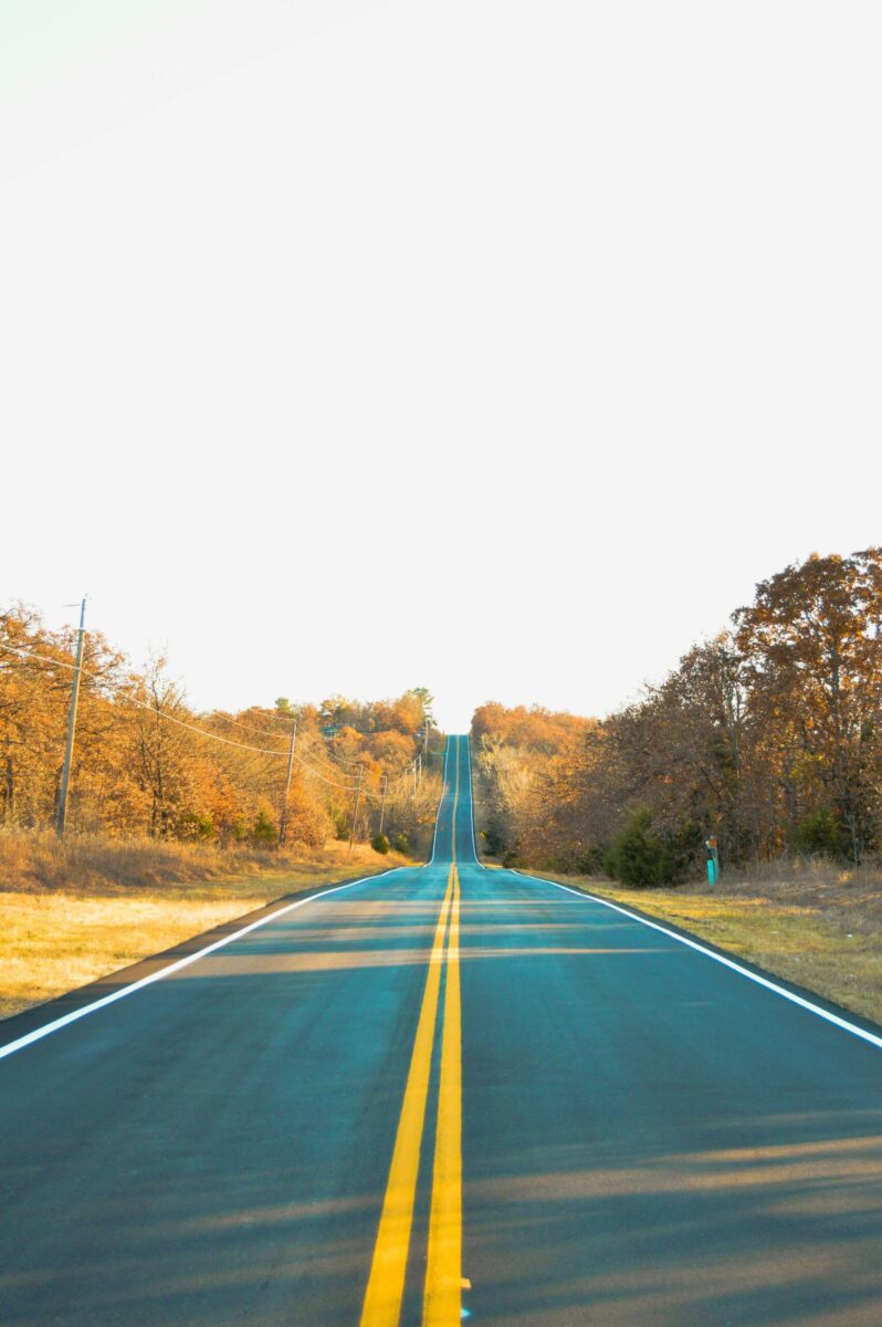 Picturesque two-lane road in Sand Springs, Oklahoma, during fall
